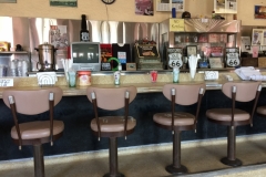 Waiter with a gun in his holster